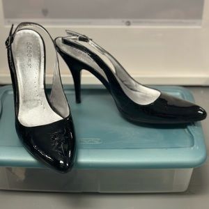 Black sling back patent leather almond toe heels